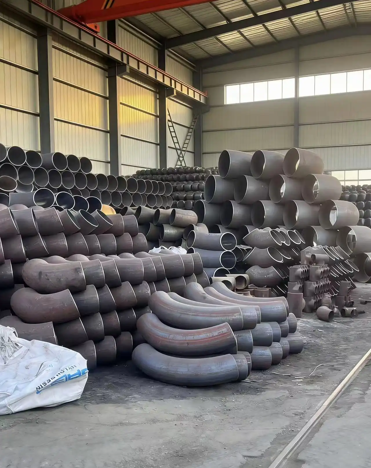 When should I choose galvanized carbon steel elbows for water pipelines